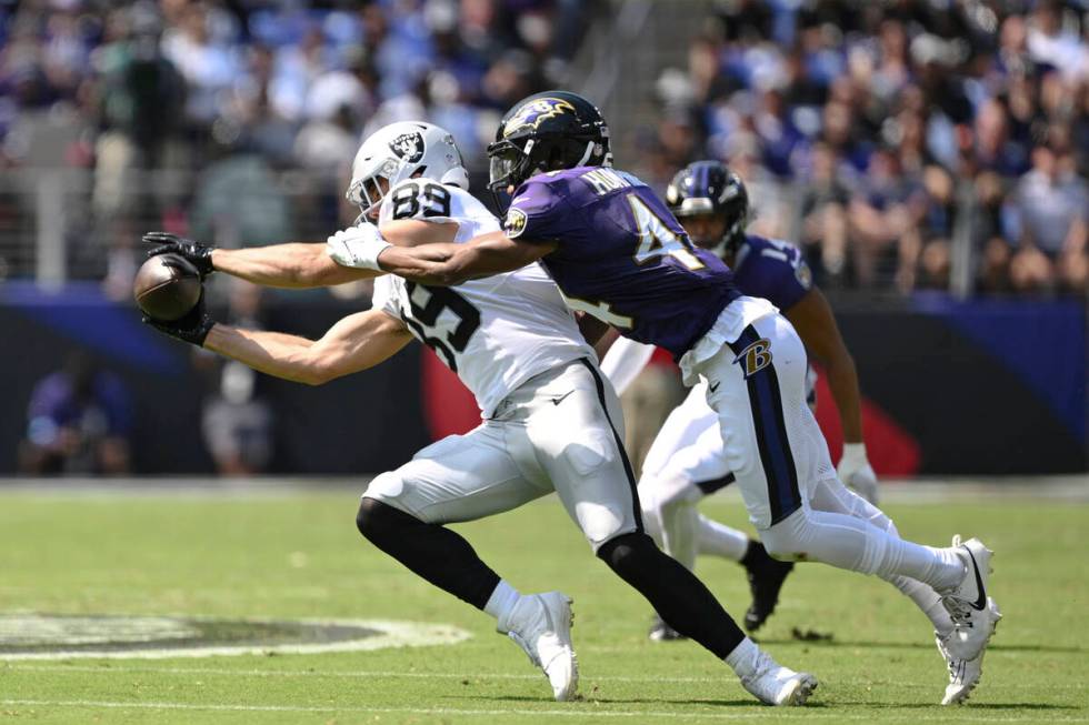 Las Vegas Raiders tight end Brock Bowers (89) catches the ball against Baltimore Ravens cornerb ...