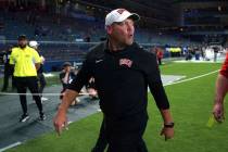 UNLV head coach Barry Odom walks off the field after win over Kansas in an NCAA college footbal ...