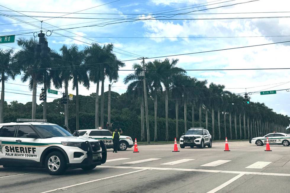 Sheriff vehicles are pictured near Trump International Golf Club, Sunday. Sept. 15, 2024, in We ...