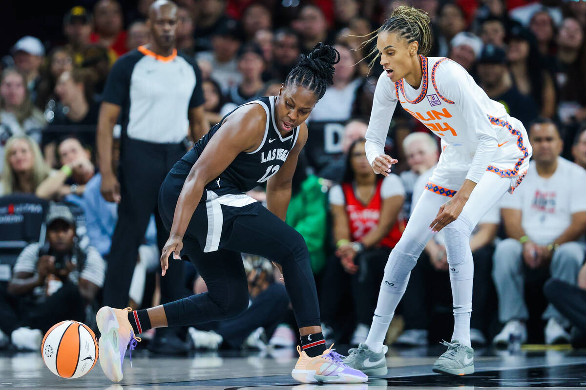 Aces guard Chelsea Gray (12) scurries to grab the ball after it escaped her grip while being gu ...