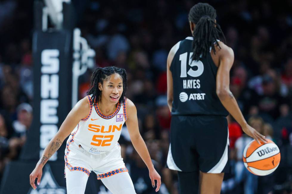 Connecticut Sun guard Tyasha Harris (52) smiles as she guards Aces guard Tiffany Hayes (15) dur ...