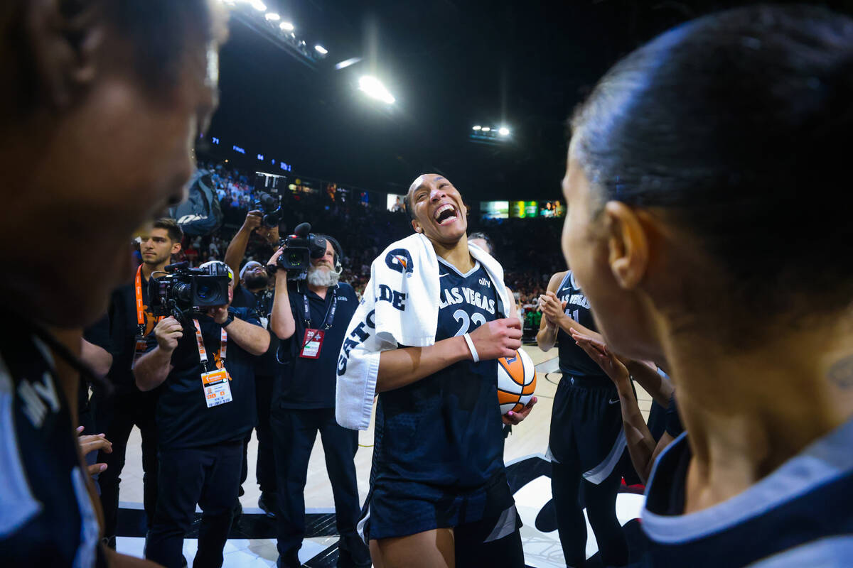 A’ja Wilson celebrates becoming the first WNBA player to score 1,000 points during a reg ...