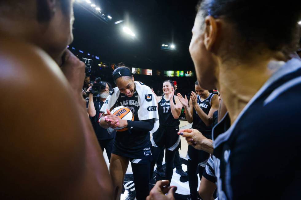 A’ja Wilson celebrates becoming the first WNBA player to score 1,000 points during a reg ...