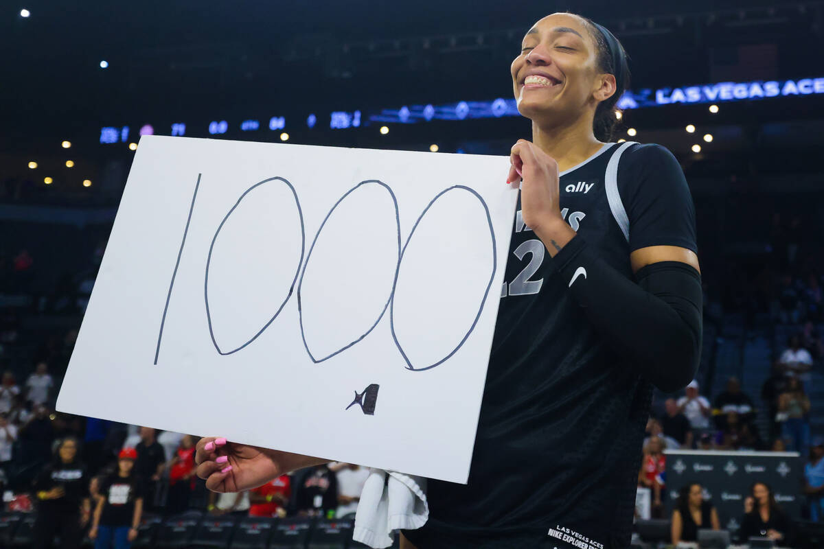 A’ja Wilson celebrates becoming the first WNBA player to score 1,000 points during a reg ...