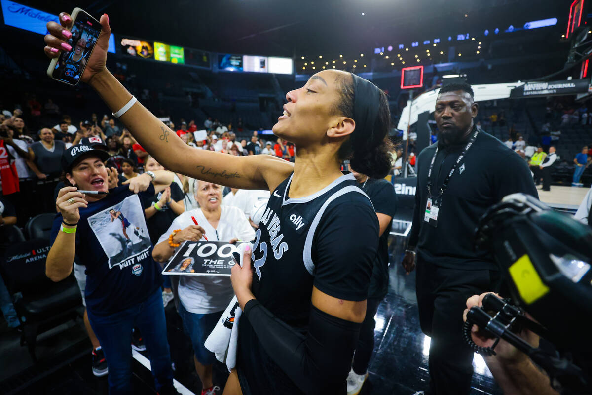 A’ja Wilson celebrates becoming the first WNBA player to score 1,000 points during a reg ...