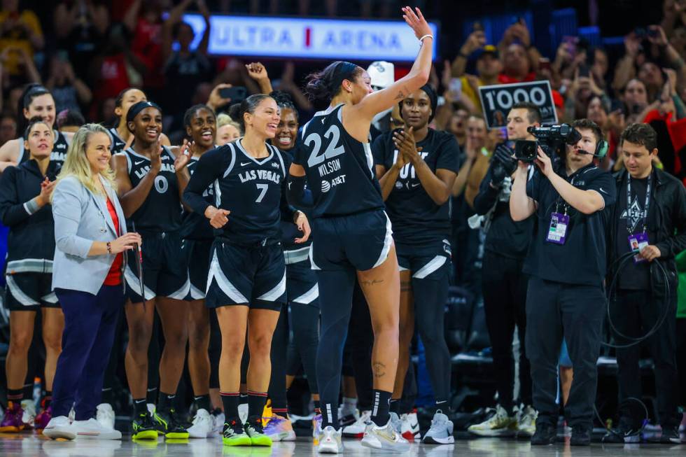 The Aces celebrate A’ja Wilson (22) becoming the first WNBA player to score 1,000 points ...