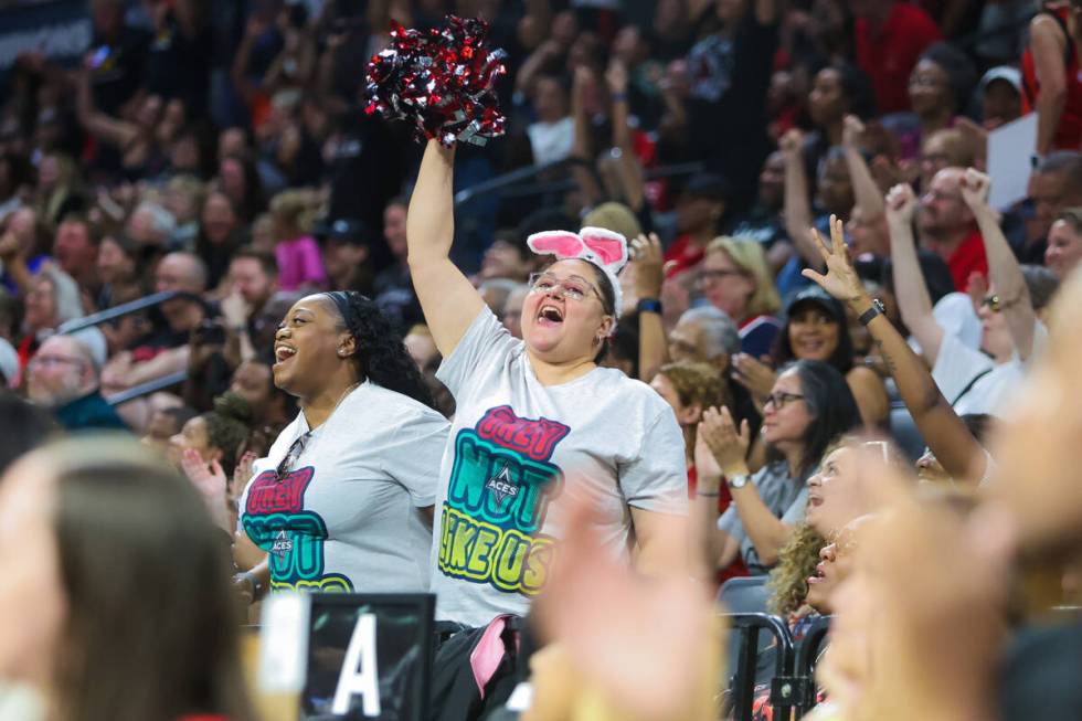 Aces fans celebrate getting free pizza after the Connecticut Sun missed two free throws during ...