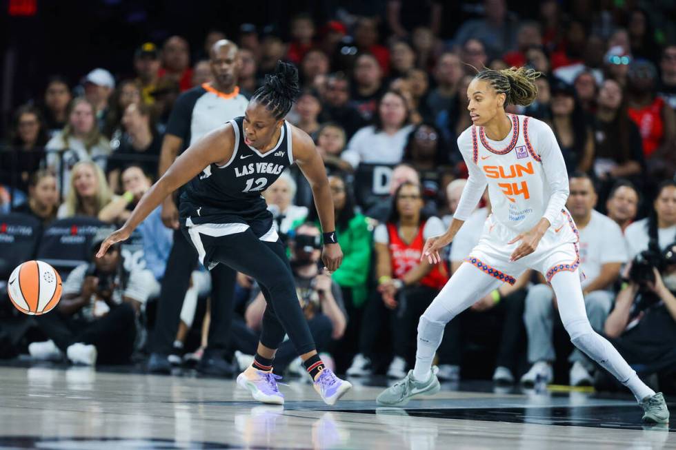 The ball escapes Aces guard Chelsea Gray (12) as she’s guarded by Connecticut Sun forwar ...