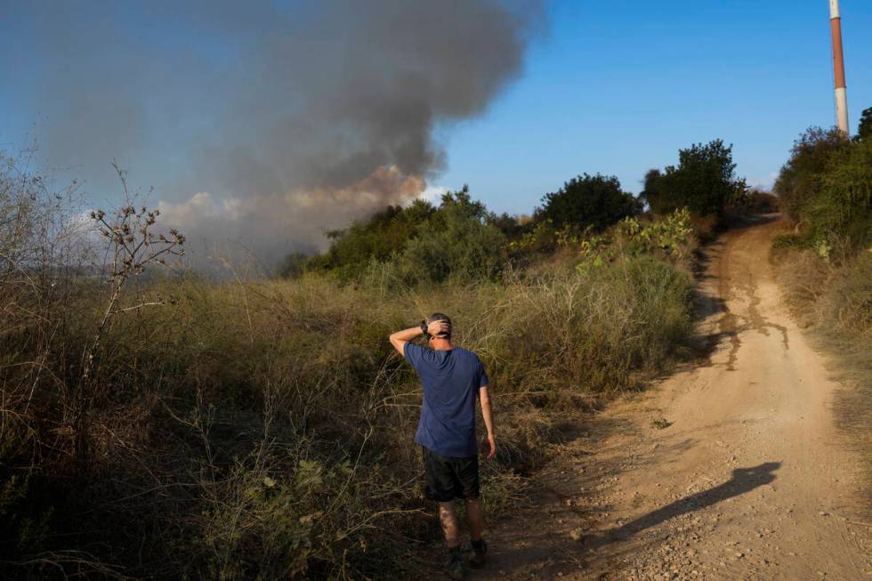 Smoke rises from a fire in central Israel after the Israeli army said a missile fired from Yeme ...