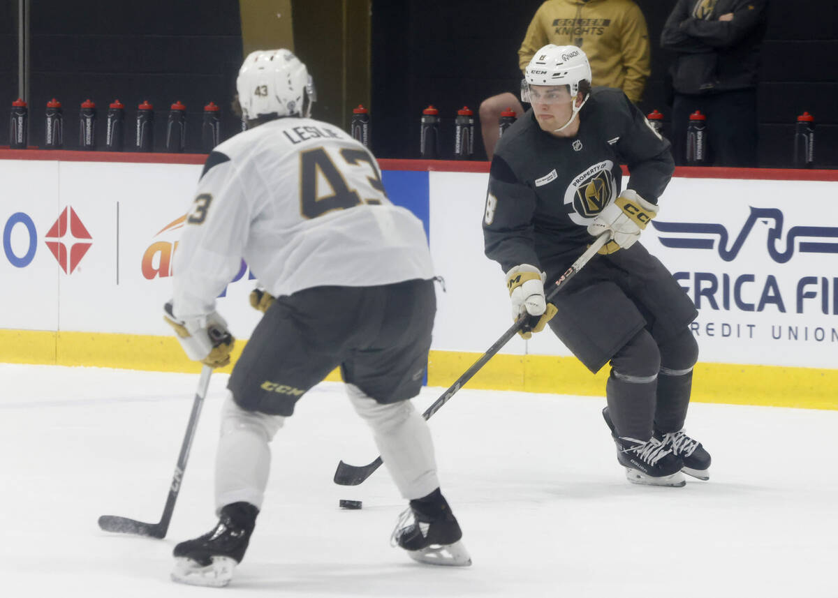 Golden Knights defenseman Mazden Leslie (43) defenses forward Mathieu Cataford (8) during first ...