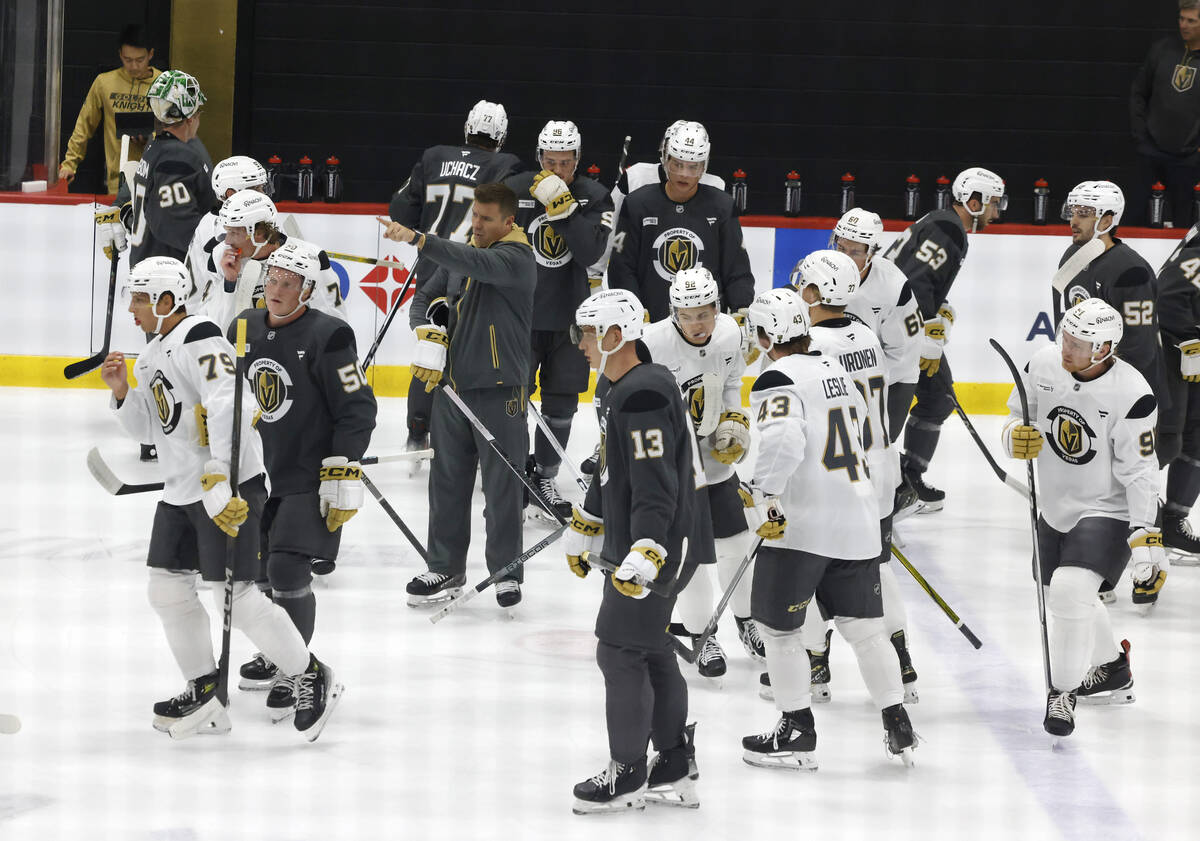 Henderson Silver Knights head coach Ryan Craig, center, directs players during first day of Gol ...