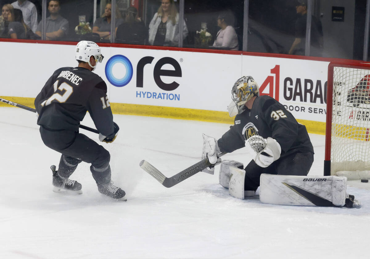 Golden Knights goalie Jesper Vikman (32) blocks forward Jakub Brabenec's (12) shot during first ...