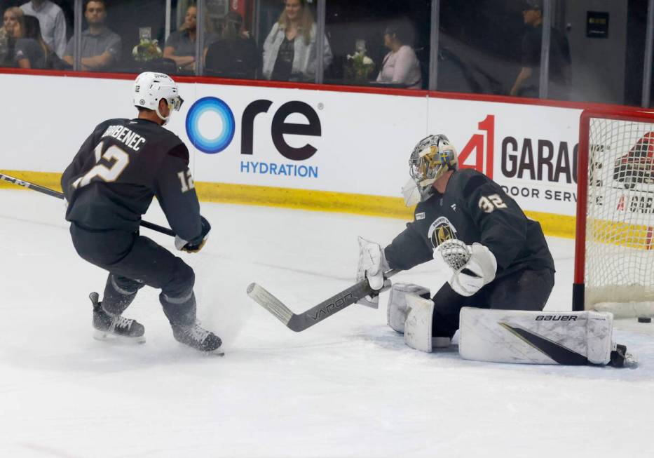 Golden Knights goalie Jesper Vikman (32) blocks forward Jakub Brabenec's (12) shot during first ...