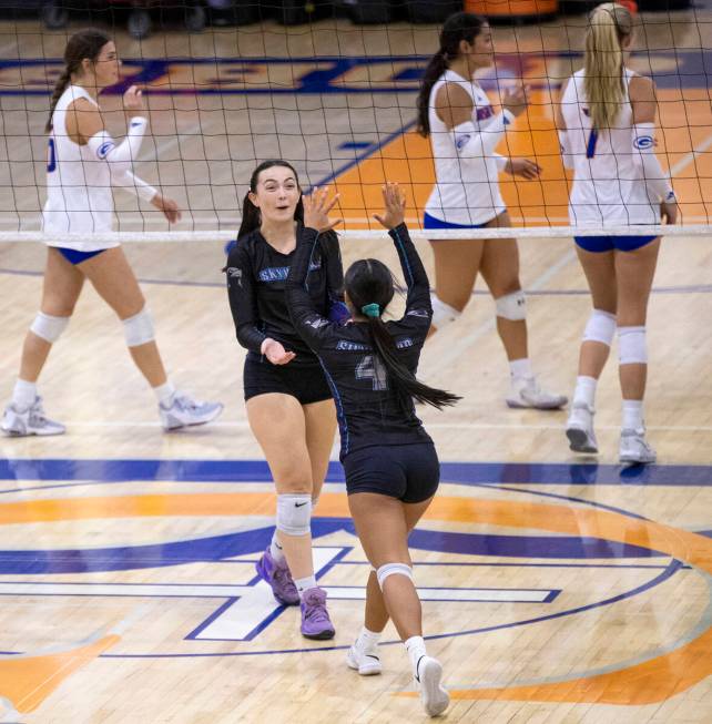 Silverado junior Nya Cimino (9) and senior Lovie Aquino (4) celebrate a point during the high s ...