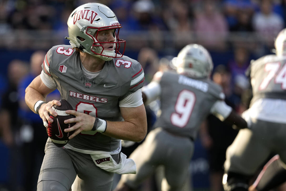 UNLV quarterback Matthew Sluka (3) looks to pass against Kansas in the first half of an NCAA co ...