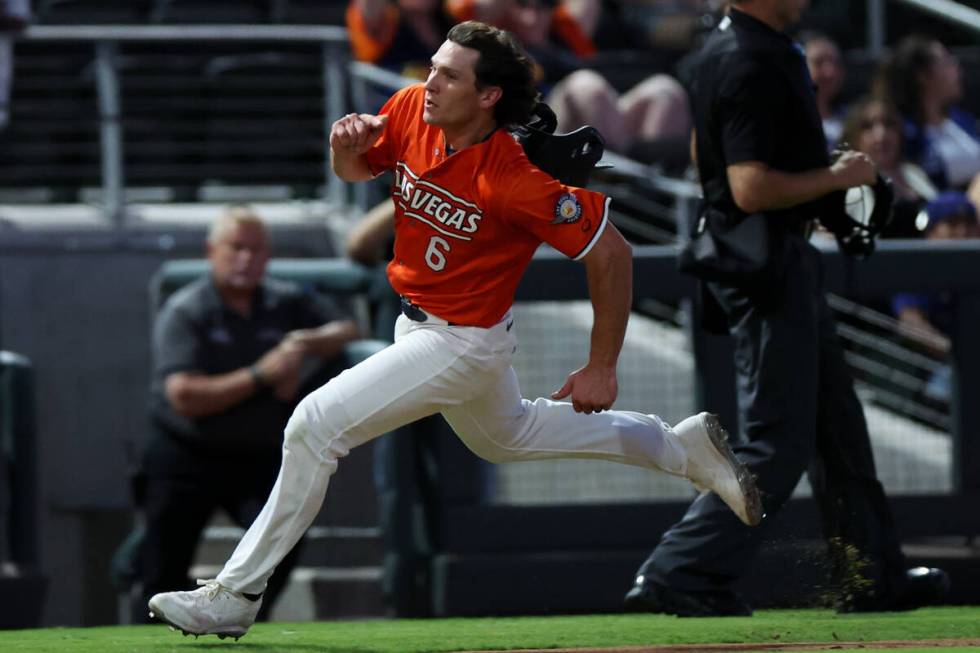 Las Vegas Aviators outfielder Colby Thomas (6) sprints for home plate before scoring during a M ...