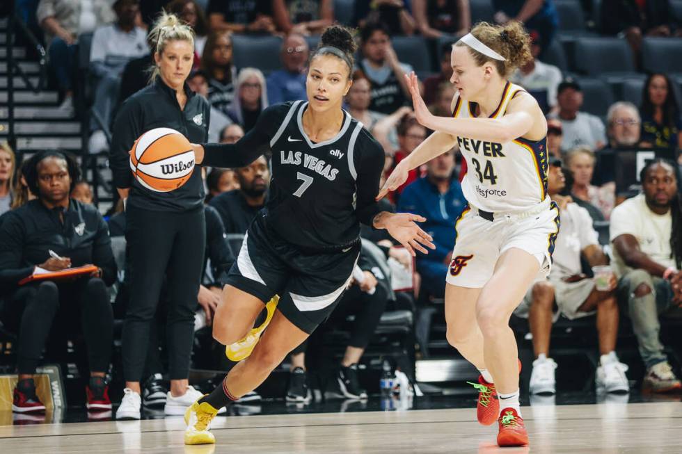 Aces forward Alysha Clark (7) drives the ball as Indiana Fever guard Grace Berger (34) guards h ...