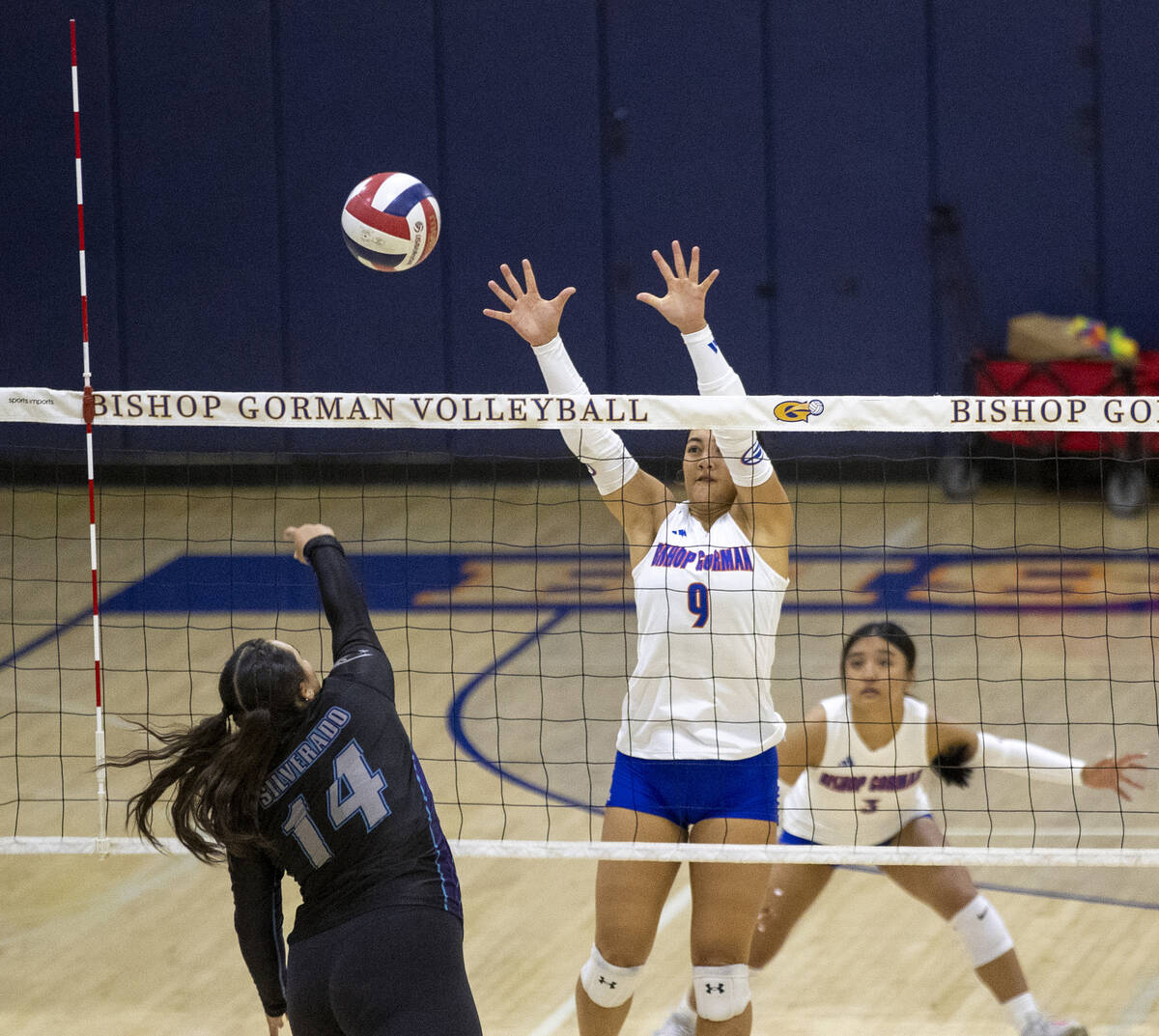 Bishop Gorman junior Trinity Thompson (9) attempts to block Silverado senior Isabella Hemingway ...