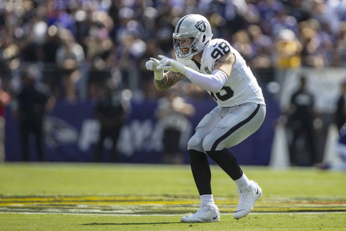 Raiders defensive end Maxx Crosby (98) celebrates a tackle for loss during the first half of an ...