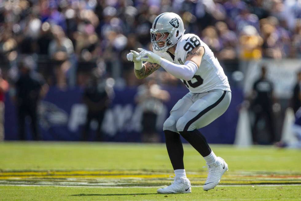 Raiders defensive end Maxx Crosby (98) celebrates a tackle for loss during the first half of an ...