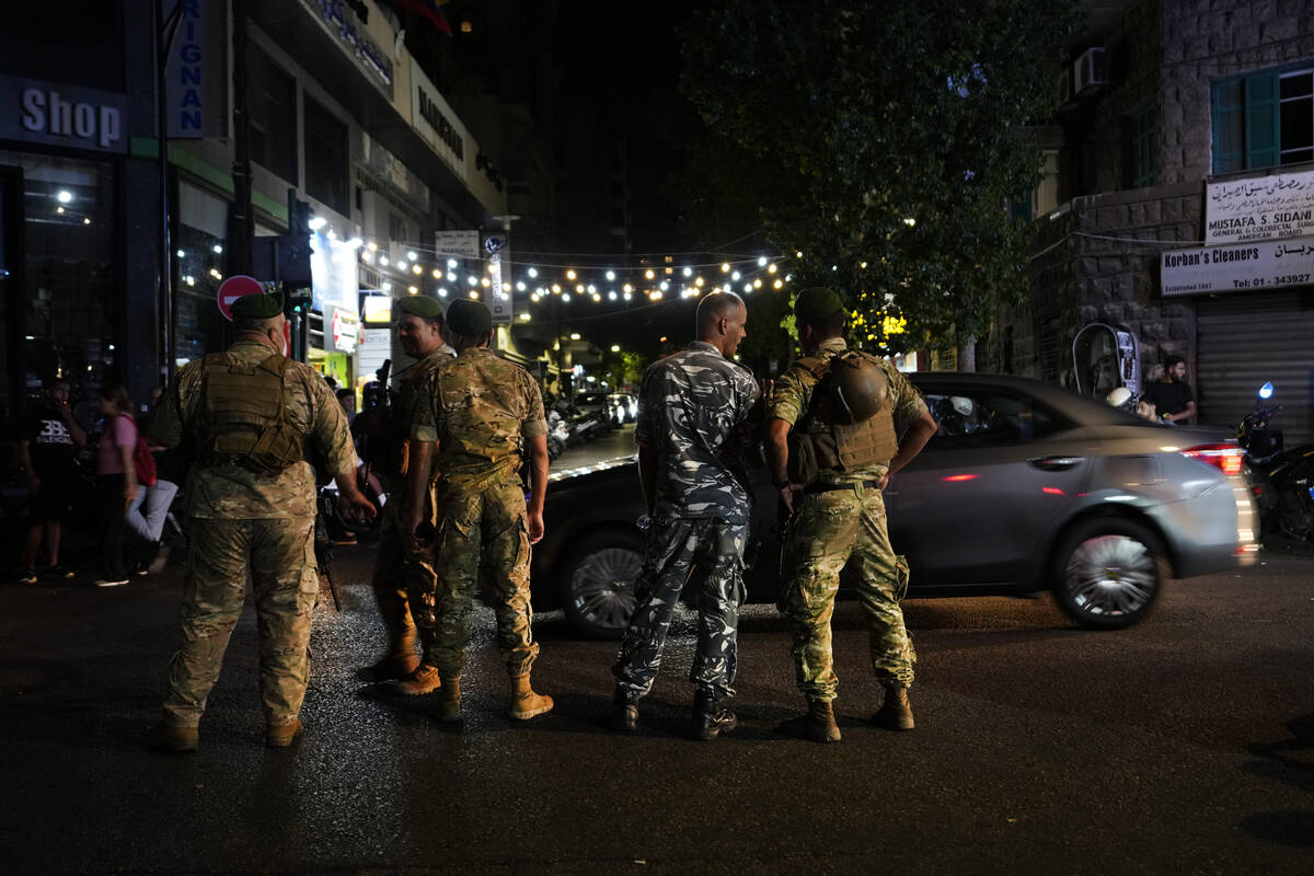 Lebanese soldiers stand guard at a street that leads to the American University hospital where ...