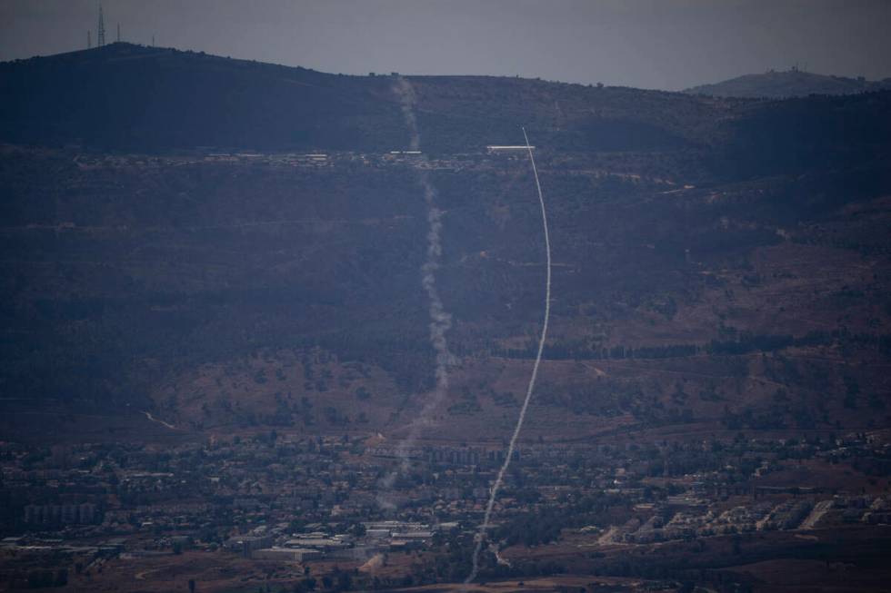 The Israeli Iron Dome air defense system fires to intercept an attack from Lebanon over the Gal ...