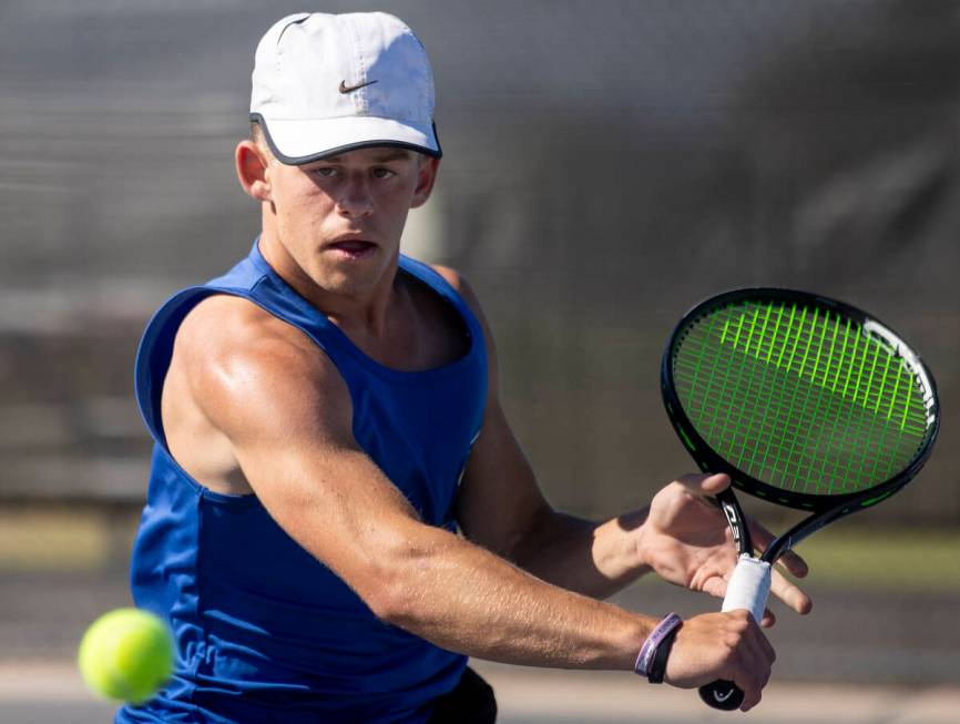 Basic’s Ryan Robinson competes during the high school tennis matches against Coronado at ...