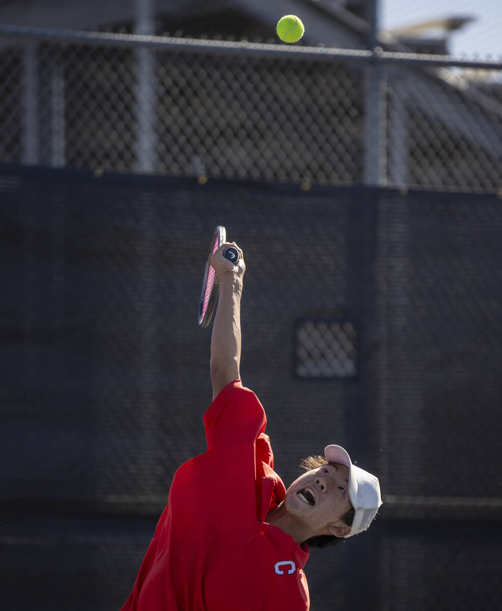 Coronado’s Grant Lee serves the ball during the high school tennis matches against Basic ...