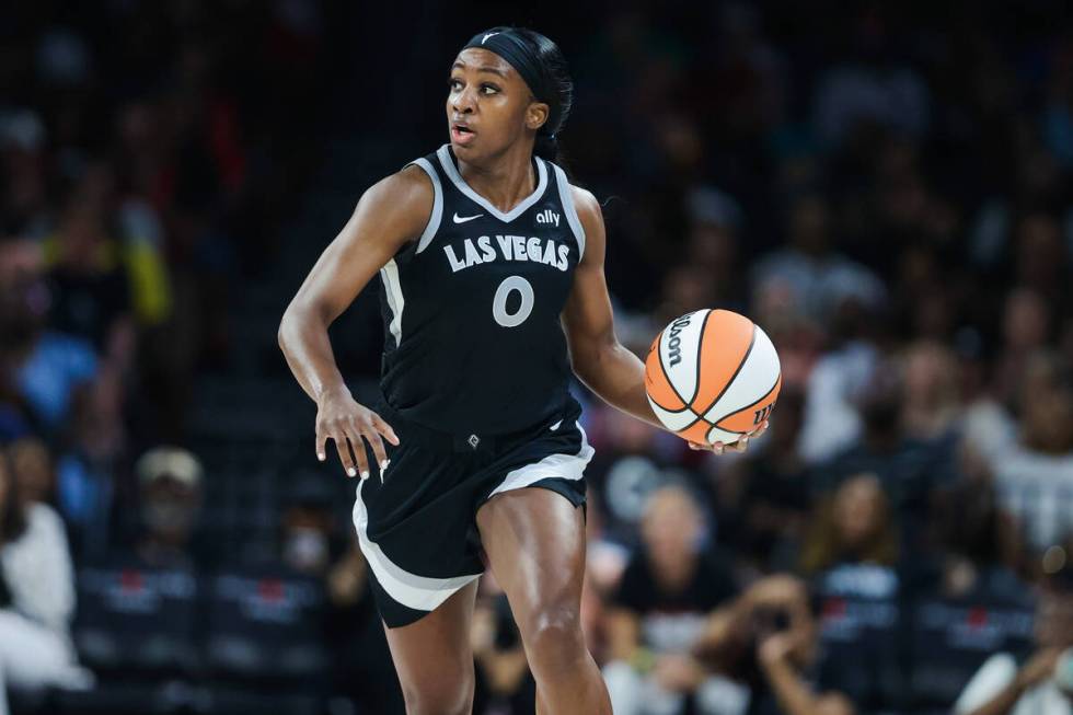 Aces guard Jackie Young (0) dribbles the ball down the court during a WNBA basketball game betw ...