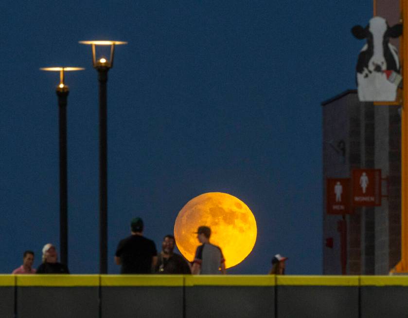 A Harvest Supermoon rises as fans gather on the wall for the Aviators against the El Paso Chihu ...