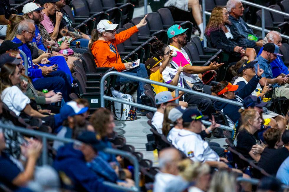 Fans signal their favorite player on a field game for the Aviators against the El Paso Chihuahu ...