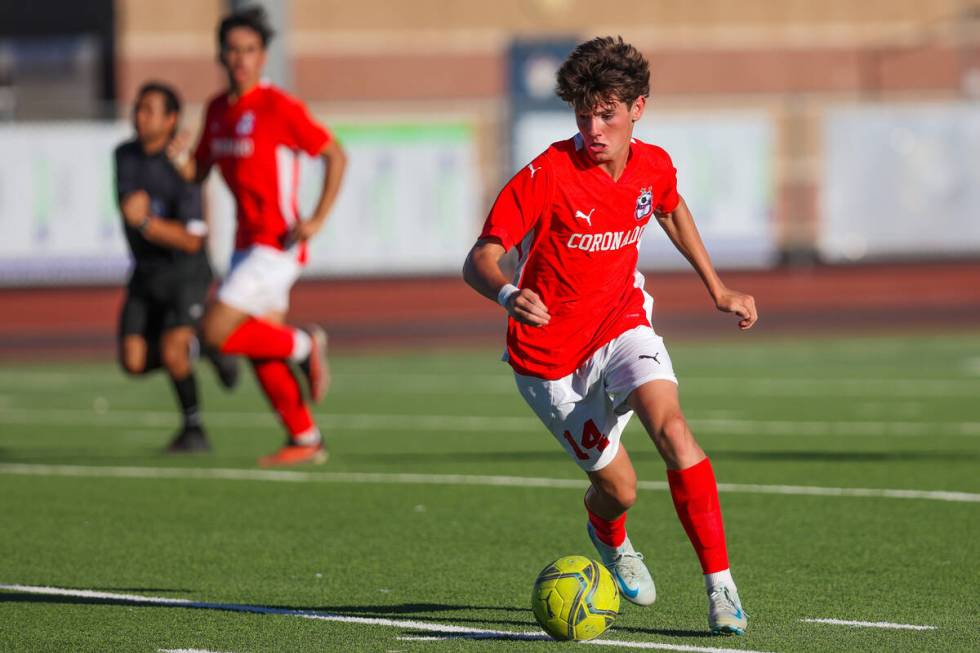 Coronado midfielder Gavin Biddinger chases the ball during a soccer game between Coronado and P ...