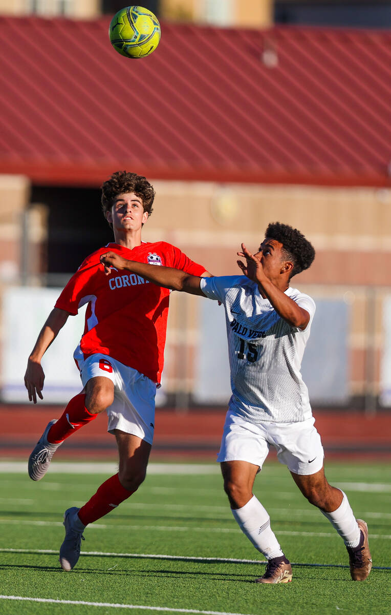 Palo Verde forward Trevon Aytch (15) and Coronado midfielder Dalton Meusy (6) race for the ball ...