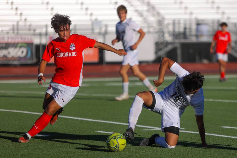 Palo Verde striker Eder Aguila (19) falls as he tries to make a run for the ball during a socce ...