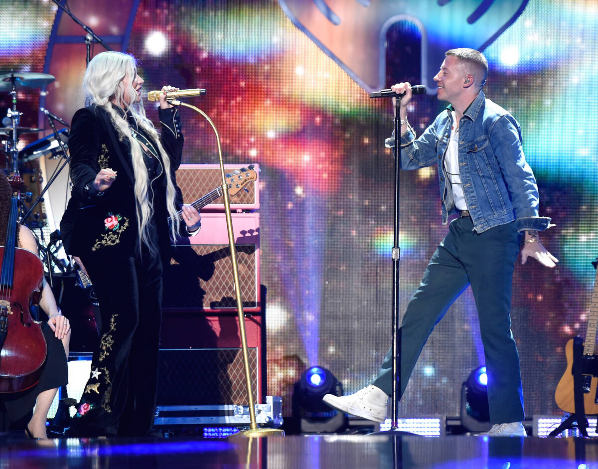 Kesha and Macklemore perform onstage during the 2017 iHeartRadio Music Festival at T-Mobile Are ...