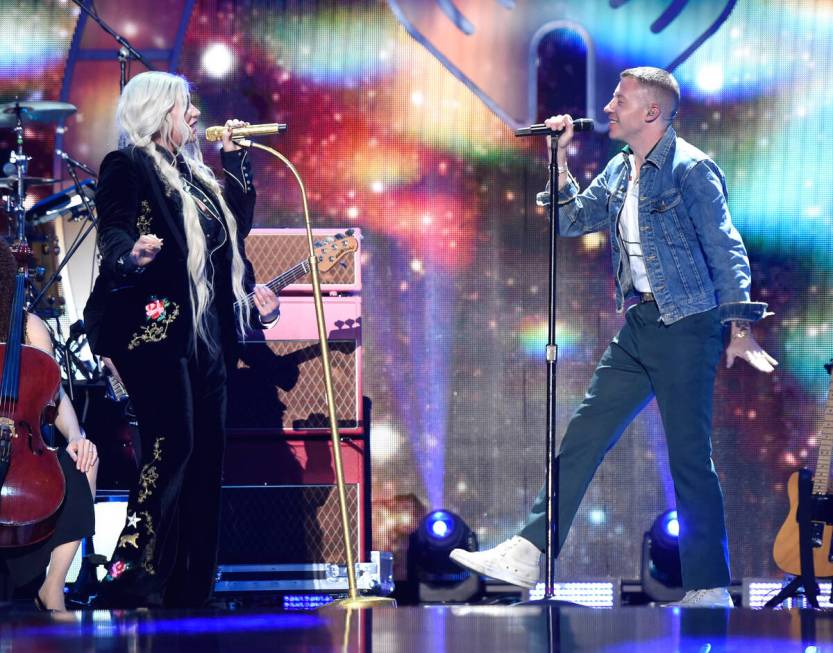 Kesha and Macklemore perform onstage during the 2017 iHeartRadio Music Festival at T-Mobile Are ...