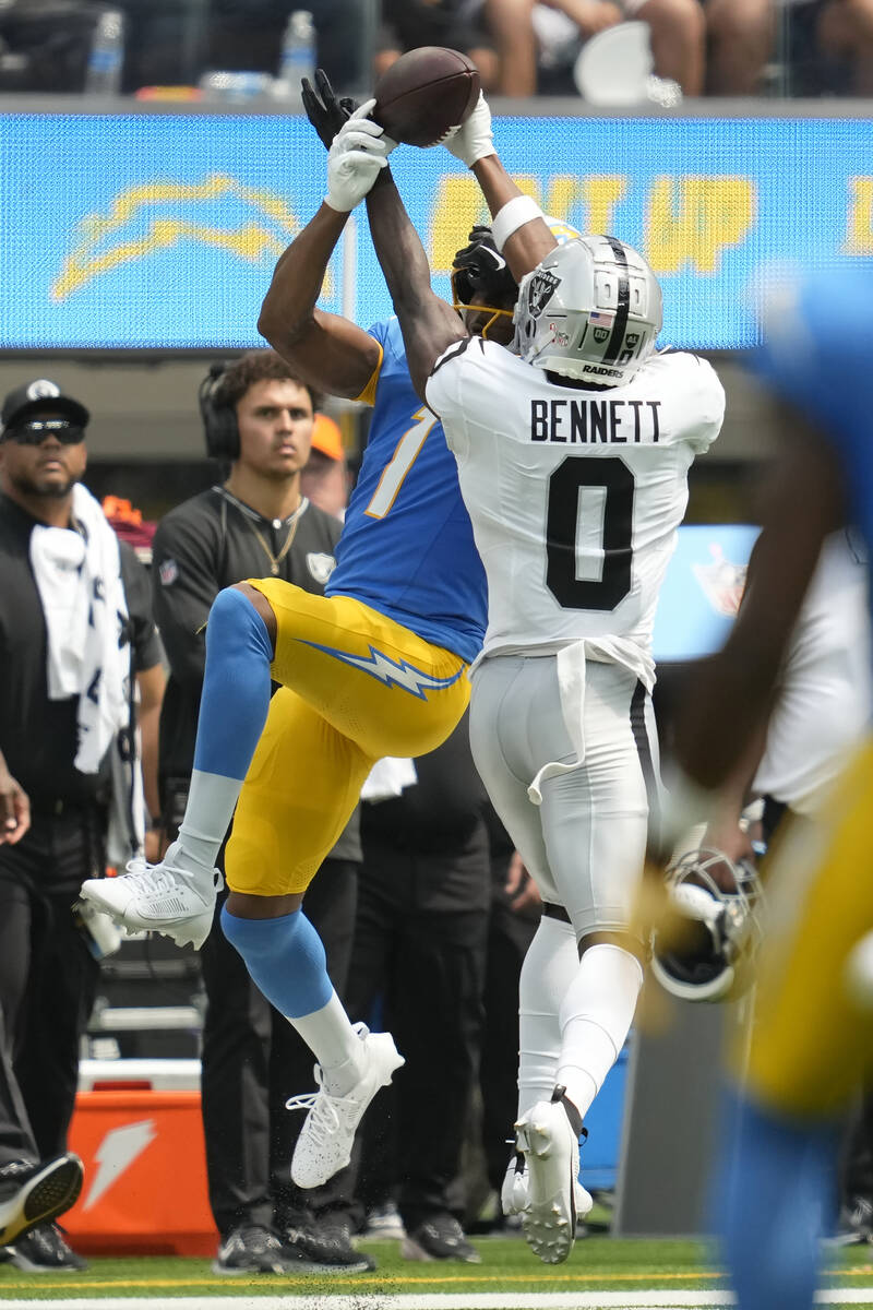 Las Vegas Raiders cornerback Jakorian Bennett (0) breaks up a pass intended for Los Angeles Cha ...