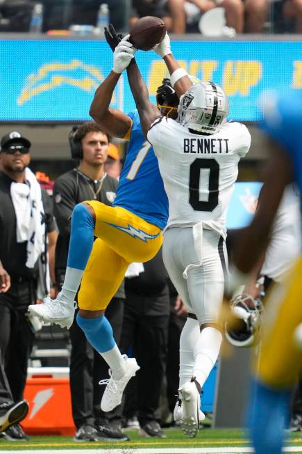 Las Vegas Raiders cornerback Jakorian Bennett (0) breaks up a pass intended for Los Angeles Cha ...