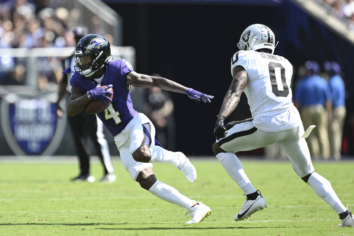 Baltimore Ravens wide receiver Zay Flowers (4) runs with the ball after catching a pass against ...