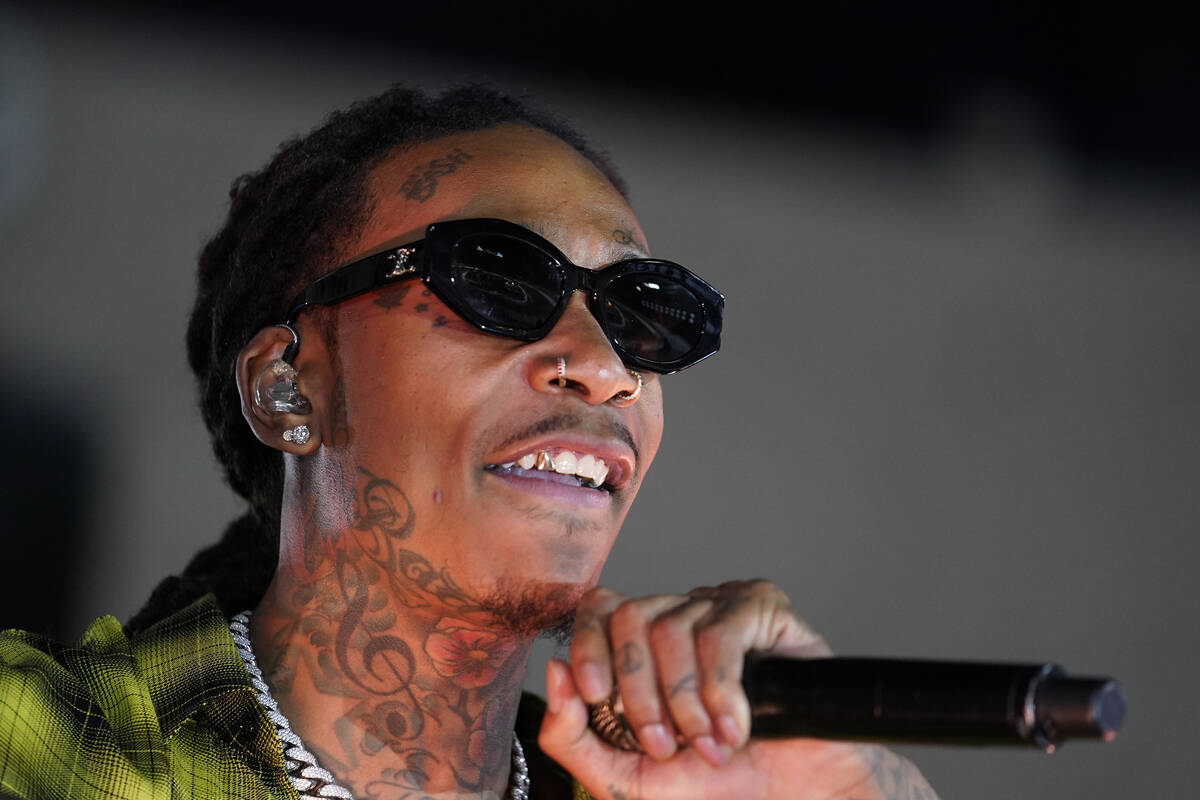 Wiz Khalifa performs during halftime of a NASCAR exhibition auto race at Los Angeles Memorial C ...