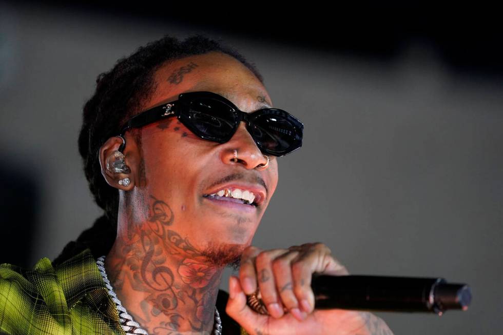 Wiz Khalifa performs during halftime of a NASCAR exhibition auto race at Los Angeles Memorial C ...