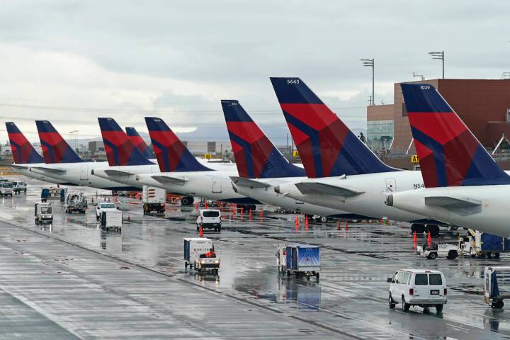 Delta planes sit at their gates on June 13, 2022, at Salt Lake City International Airport, in S ...