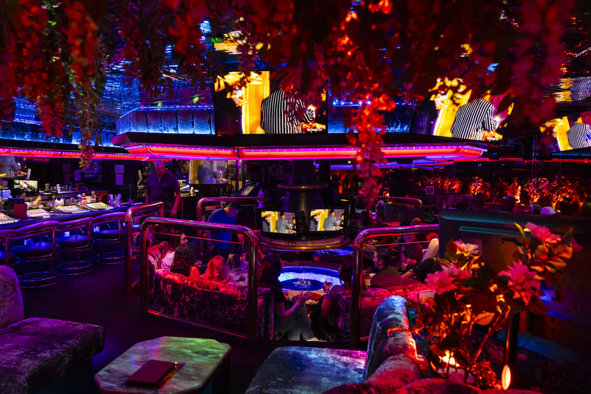 People sit around the fire pit at the Fireside Lounge at the Peppermill on Tuesday, Sept. 24, 2 ...