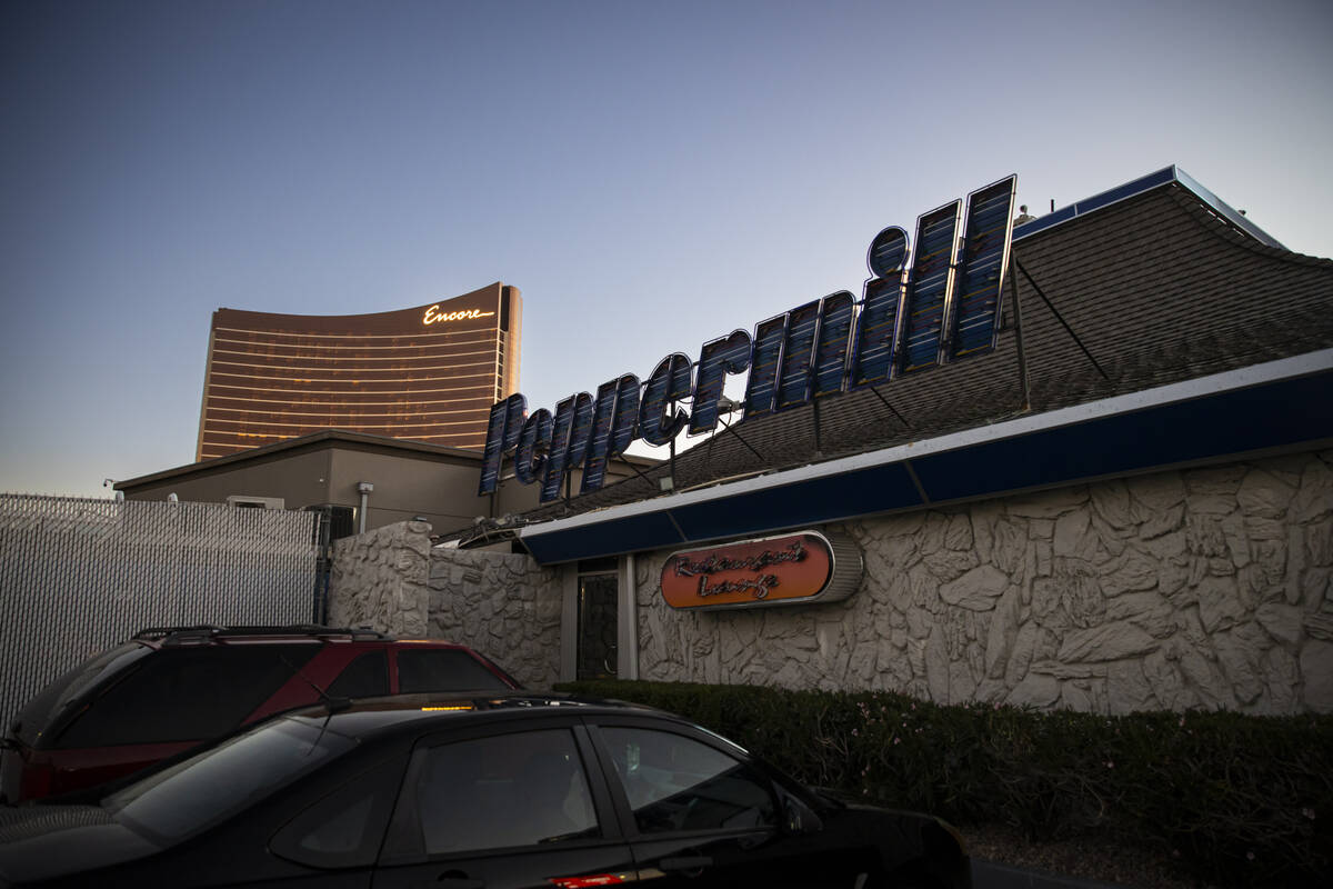 An exterior view from the back showing the old signage at the Peppermill Restaurant and Firesid ...