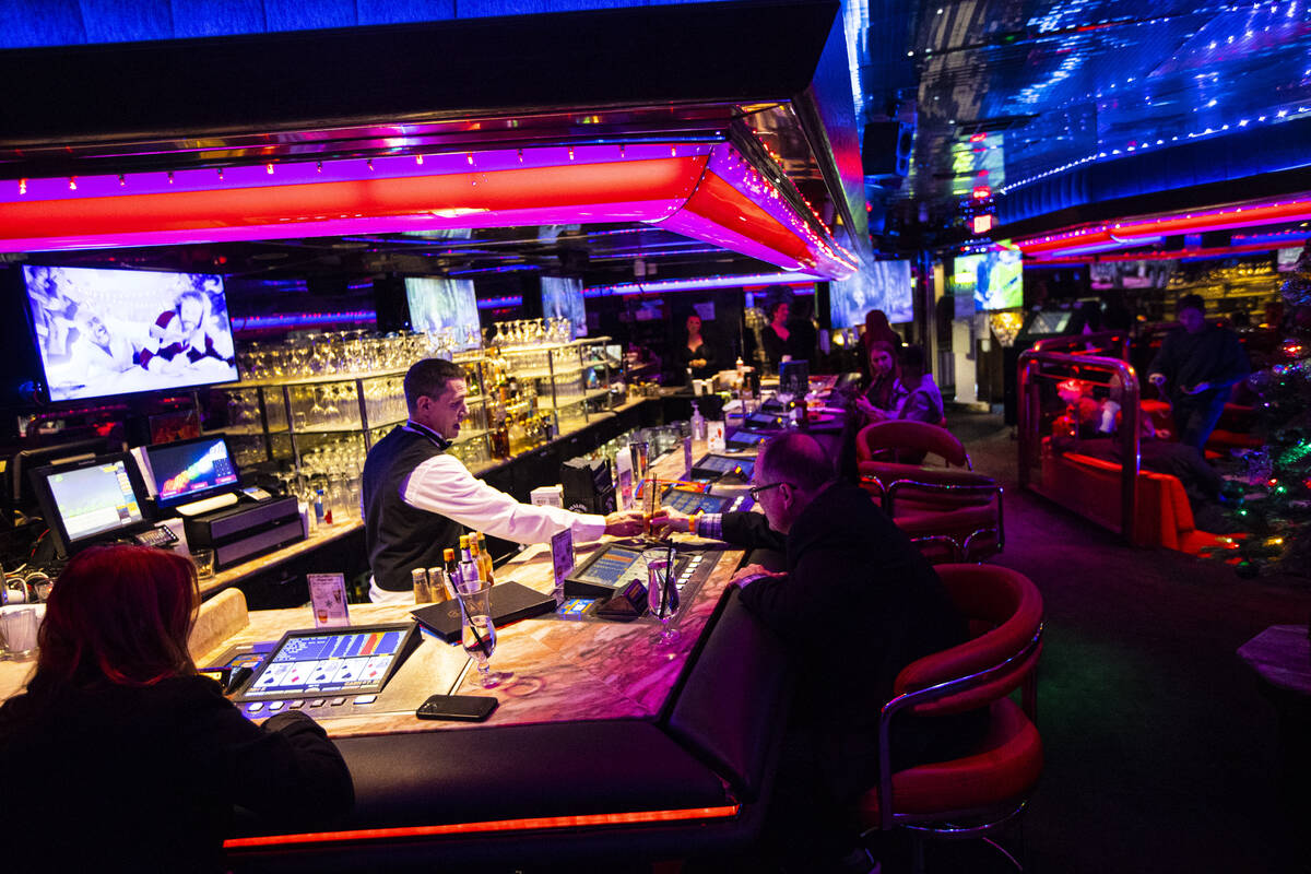 Bartender Kyle Tomsic serves a customer in the Fireside Lounge at Peppermill on Tuesday, Dec. 1 ...