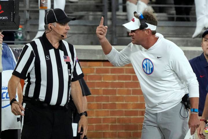 Mississippi head coach Lane Kiffin argues a call with an official during the first half of an N ...