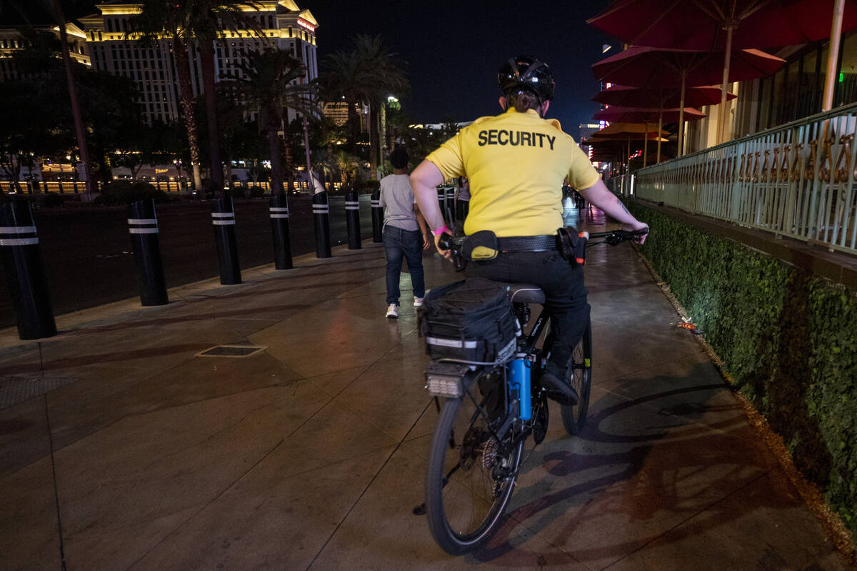 A security guard bikes near the Paris Las Vegas on the Strip on Oct. 8, 2020, in Las Vegas. (La ...