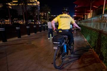 A security guard bikes near the Paris Las Vegas on the Strip on Oct. 8, 2020, in Las Vegas. (La ...