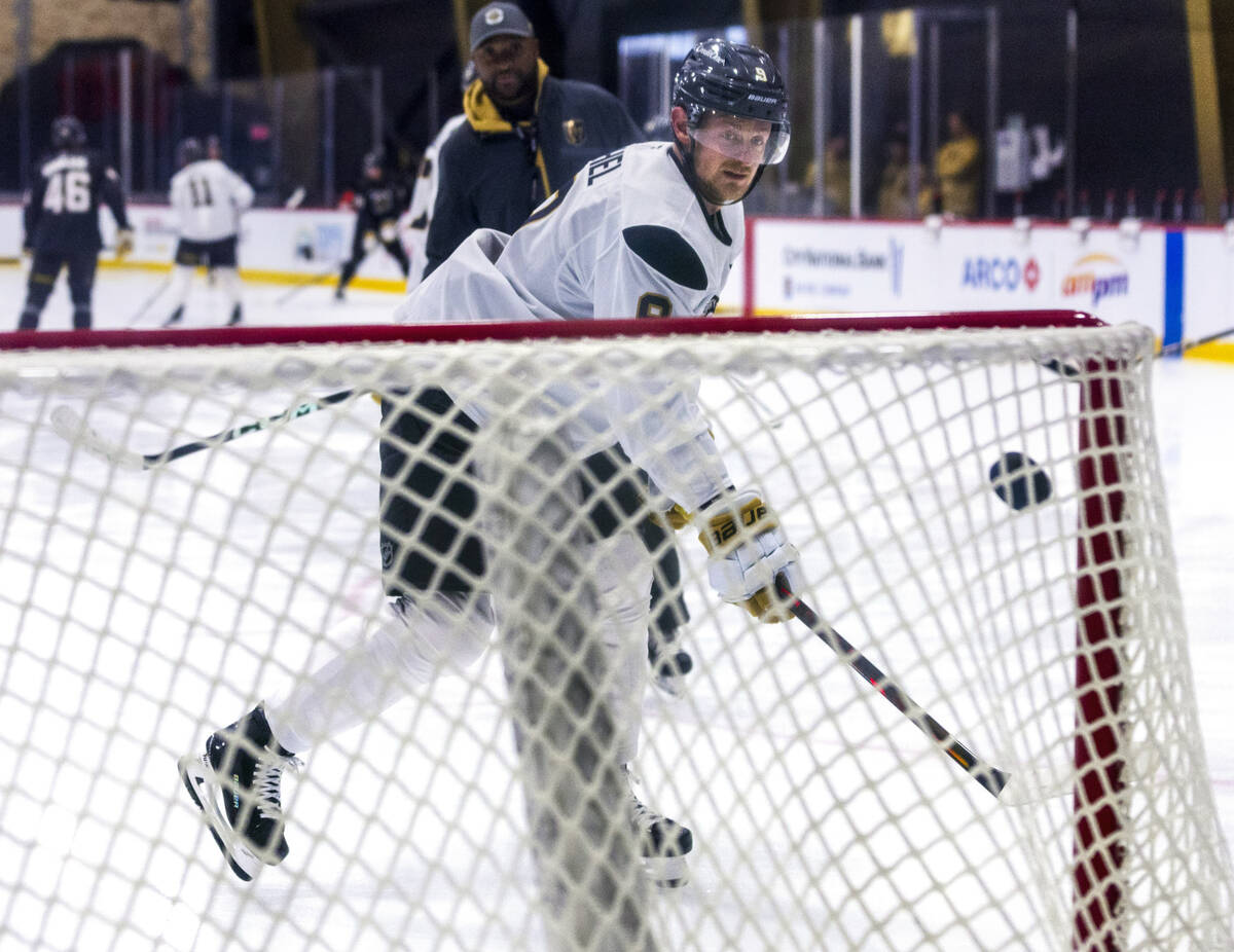 Vegas Golden Knights center Jack Eichel (9) takes a shot on goal during the first day of traini ...