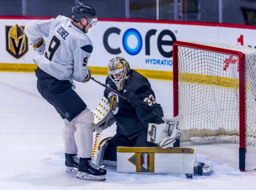 Golden Knights center Jack Eichel (9) attempts to score on goaltender Adin Hill (33) during the ...